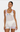 Woman wearing a white crochet dress with floral patterns on a white background