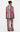 A model shown from the back wearing a matching two-piece pajama set with vertical multicolor stripes and a tiger print, on a plain white background.