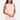 Woman wearing a light pink dress against a white background