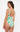 Woman wearing a green and white patterned swimsuit on a white background