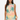 Woman wearing a sleeveless dress with palm tree and sunset design on a plain background