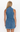 Back view of a person wearing a denim dress on a white background