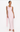Woman wearing a light pink sleeveless gown on a white background