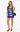Woman wearing a navy dress with fish patterns on a white background