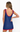 Woman wearing a blue tank top with red trim on a white background
