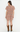 A woman shown from the back wearing a short-sleeve floral mini dress with ruffled trim and brown cowboy boots, photographed against a plain white studio background.