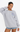 Woman wearing a gray sweatshirt with a logo on a white background