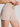 Beige shorts worn by a person on a plain background