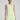 Woman wearing a light green sleeveless top and shorts set on a plain background