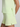 Light green shorts and top on a plain background