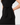 Black dress with a bow detail on a white background