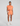 Woman wearing an orange outfit on a gray background