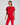 Woman wearing a red outfit on a plain background