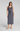WOMAN WEARING A GRAY SPANX SLEEVELESS MAXI DRESS