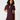 A woman modeling a short-sleeve bodycon mini dress in deep burgundy with a keyhole cutout at the neckline, set against a plain light gray studio background.