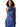 A woman modeling a satin halter-neck dress in a rich royal blue color, shown against a plain white background.