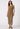 Woman wearing a patterned dress on a white background