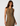 Woman wearing a patterned dress on a white background