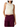 A woman wearing a sleeveless cream-colored draped mock-neck top paired with dark purple cargo pants, shown against a plain white background.