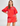Woman wearing a red outfit with floral patterns on a white background