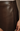 Close-up of a dark brown faux-leather mini skirt with a side seam detail, worn by a model whose hand is visible on the right.