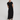 Woman wearing a black dress with a tie waist on a white background