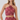 A woman modeling a two-piece halter crop top and matching high-waisted skirt set in a dusty rose and pink paisley pattern, against a light gray studio background.