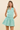 STRIPED V-NECK SMOCKED MINI DRESS IN GREEN