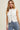 SLEEVELESS BUTTON UP SWEATER VEST IN WHITE