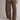 A person wearing wide-leg brown drawstring pants with large front patch pockets and olive green lace-up boots, photographed against a plain light gray studio background.