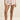 Person wearing pink floral shorts on a beige background