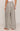 Plaid pants worn by a person on a plain background