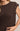 Brown sleeveless top with button details on a neutral background