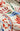 Colorful fabric with 'LEMON LIMES' text and abstract designs.