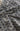 A close-up of a draped fabric with a dense navy blue floral or damask pattern on a warm beige background.