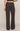 Dark brown wide-leg pants worn by a person on a beige background