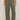 Person wearing olive green cargo pants on a plain background