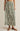 Long floral skirt with green pattern on a neutral background