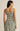 Woman wearing a floral dress with a neutral background