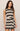 Woman wearing a black and white striped dress on a beige background