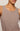 Brown tank top worn by a person on a neutral background