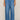 Blue denim wide-leg pants worn by a person on a plain background