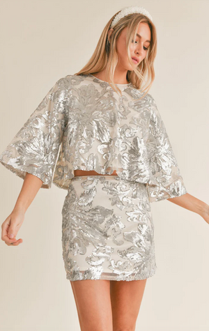 AURA SEQUIN FLARE TOP IN CHAMPAGNE SILVER
