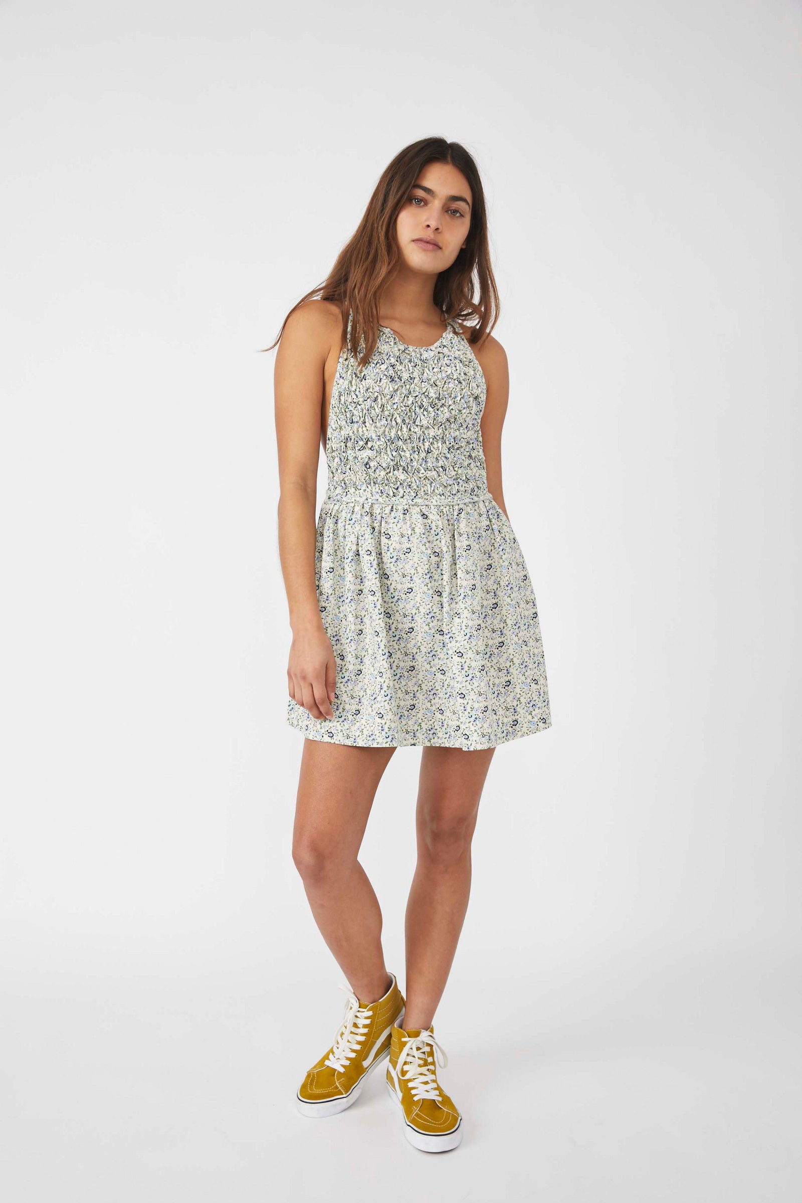 FREE PEOPLE PETUNIA MINI DRESS - This apron silhouette mini dress has a textured bodice, scoop necklines, side packets and crisscross straps in the back.  ShopIDB.com